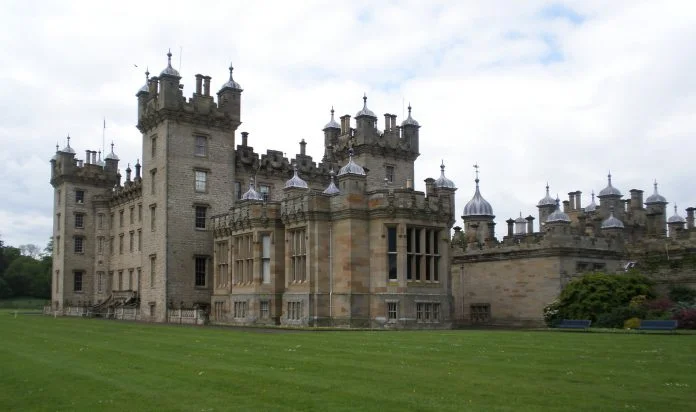 Floors castle surrounded by green grasses.