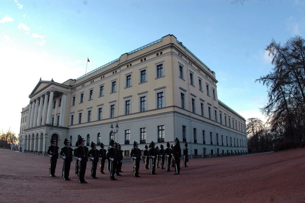 His Majesty The King’s Guard standing to attention outside the Palace of Oslo.